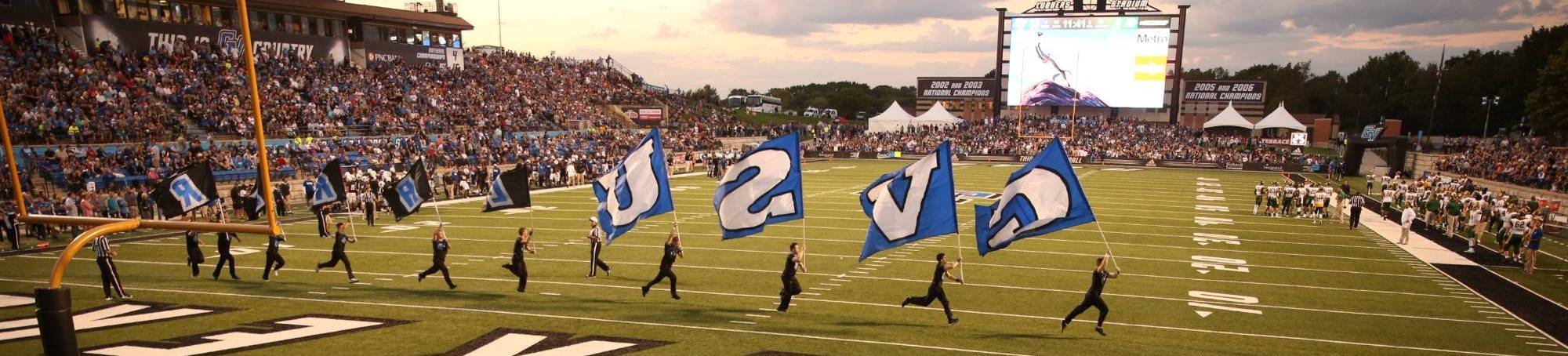 GVSU marching band running out on football field